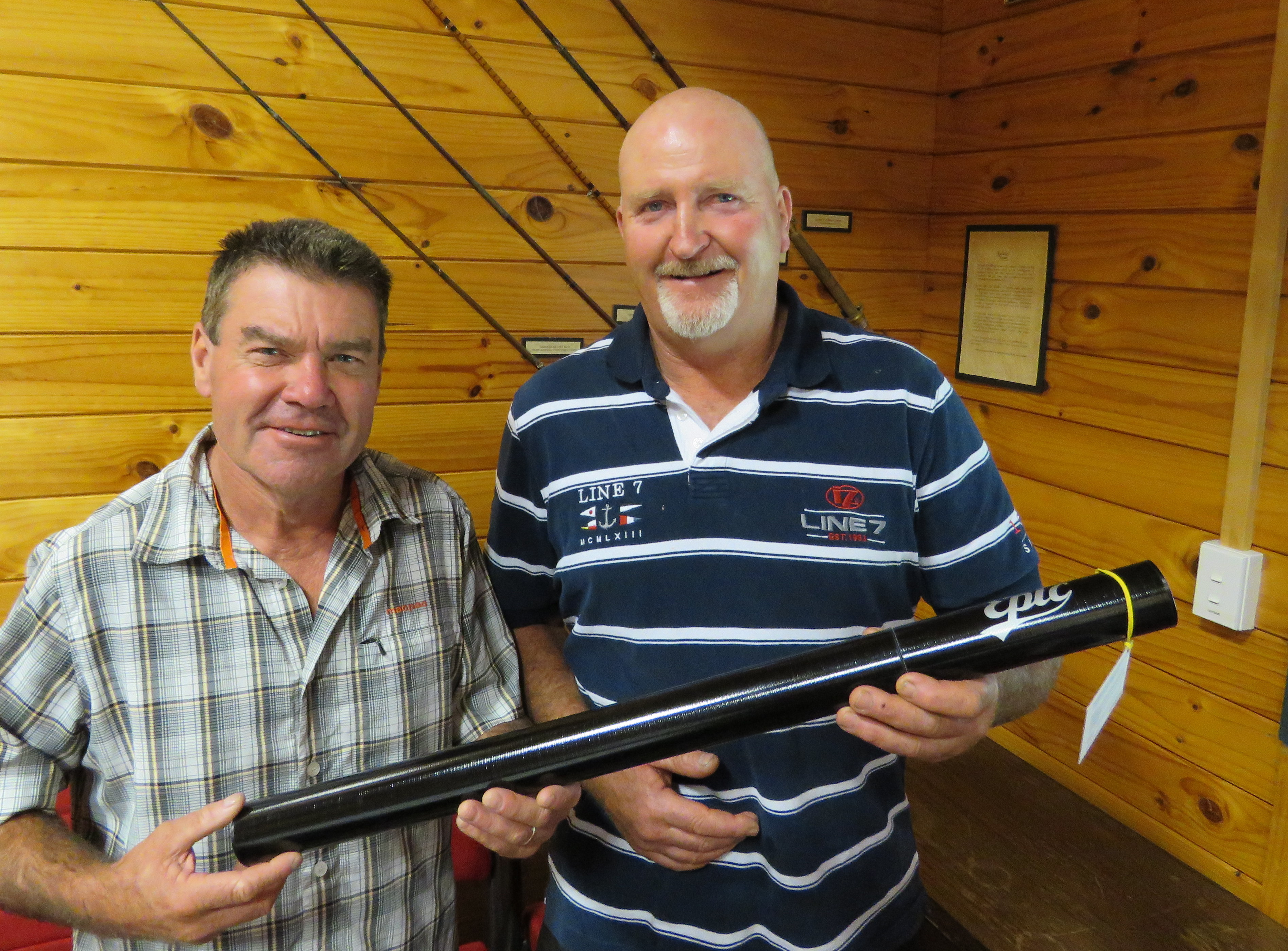 Eastern Region Fish Game Manager Andy Garrick presents Kevin Taylor with his prize a hand made Epic carbon fibre rod2.