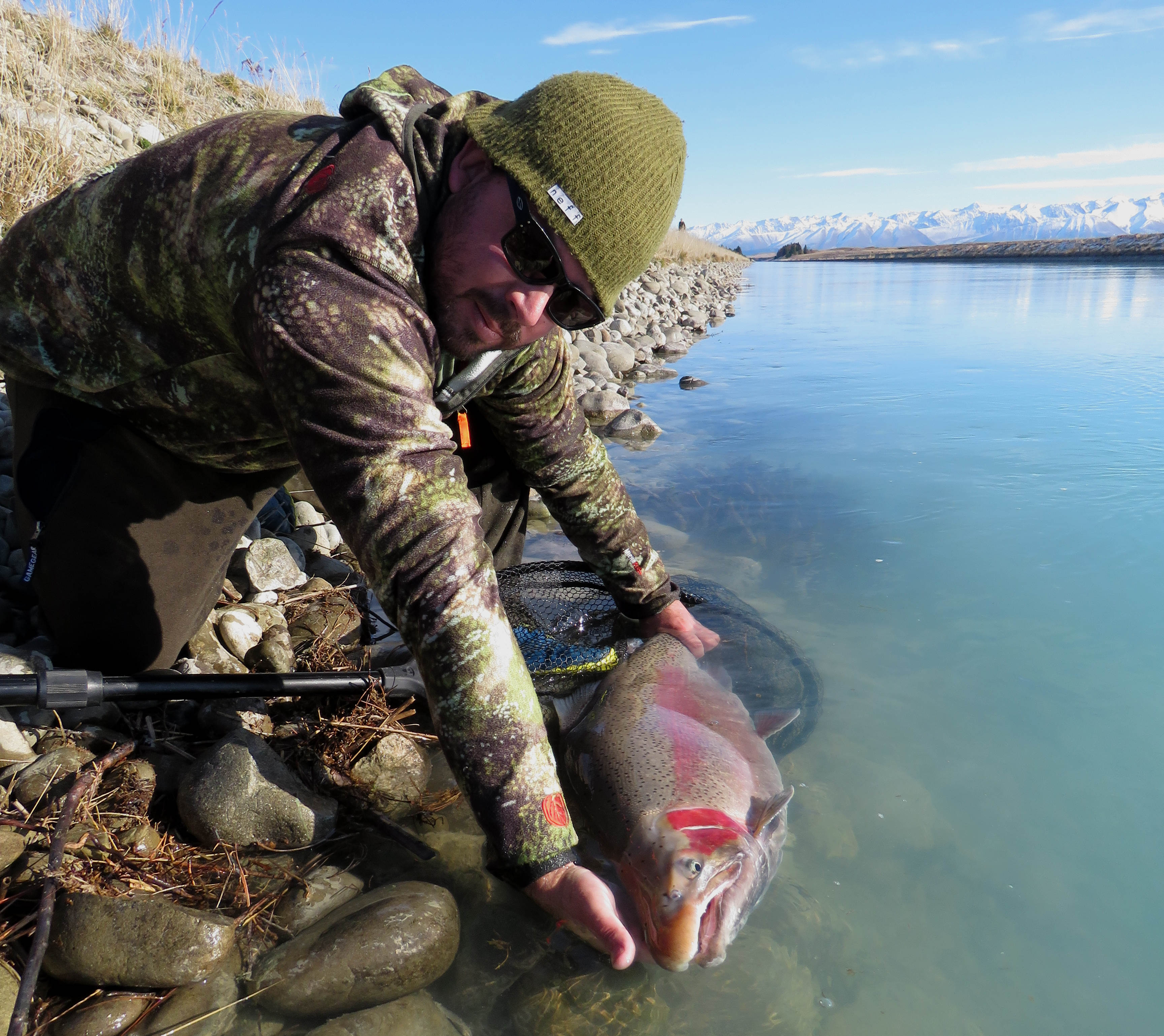 Photo 3 Jarrod Bedford releasing a 24 pound 10.9kg rainbow trout caught at the upper Tekapo Canal in June 2020 credit R Adams