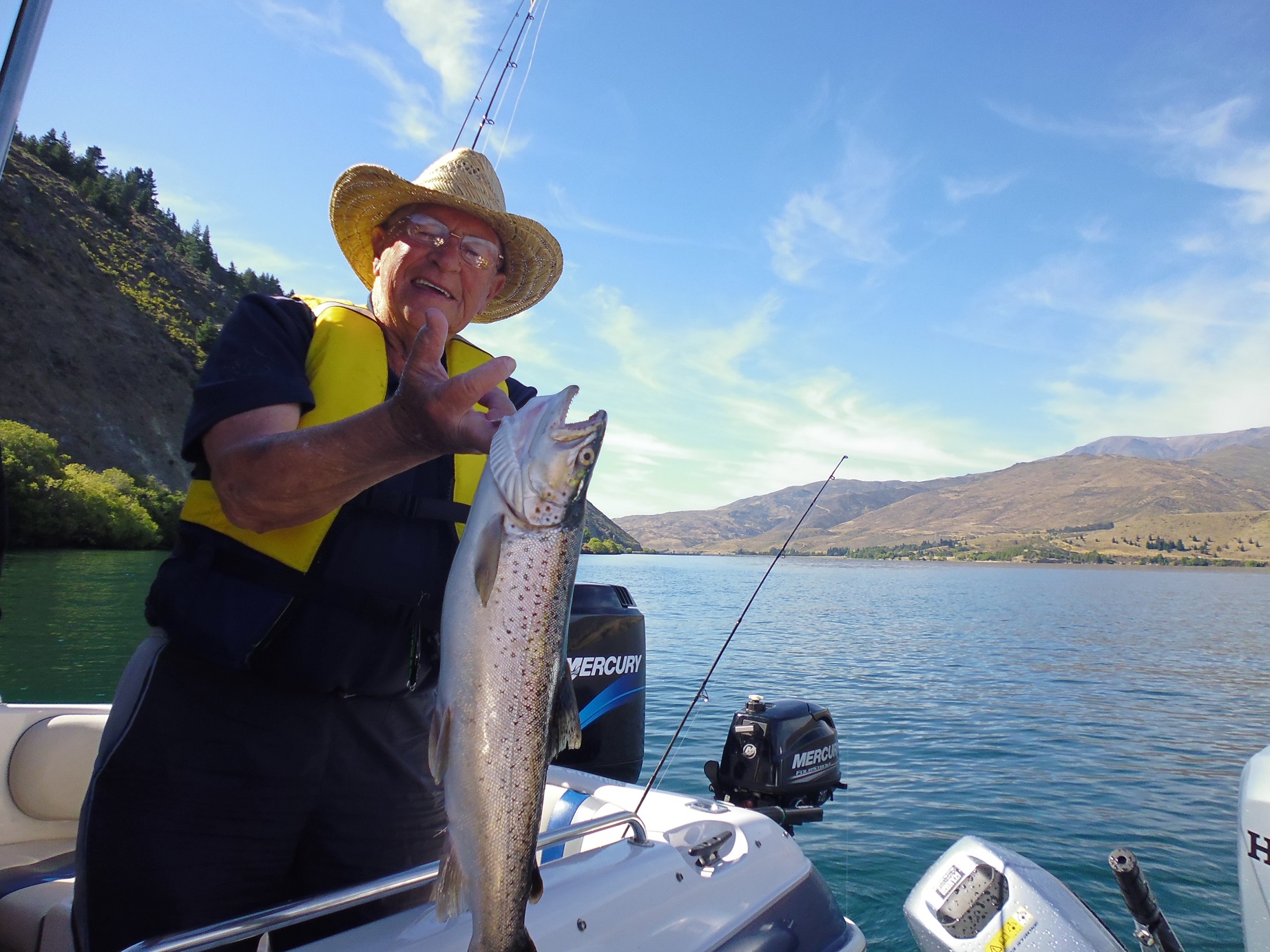 RLcsi3JAN18 Peter Keller produces his catch for the ranger Lake Aviemore December 2017