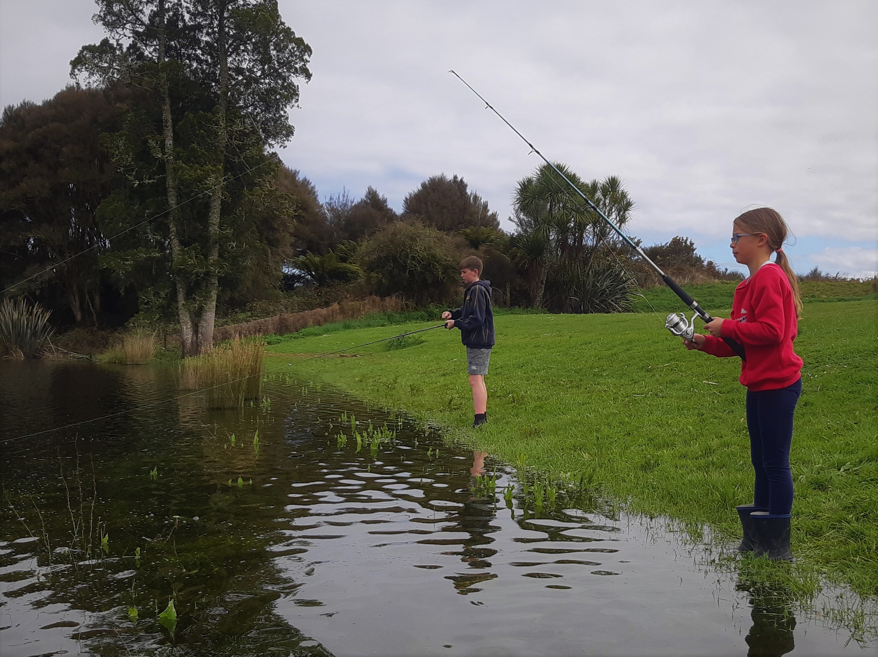 First time anglers Hayley Hoare and Toby Gallagher trying their luck in Lake Brunner on opening day. photo Baylee Kersten