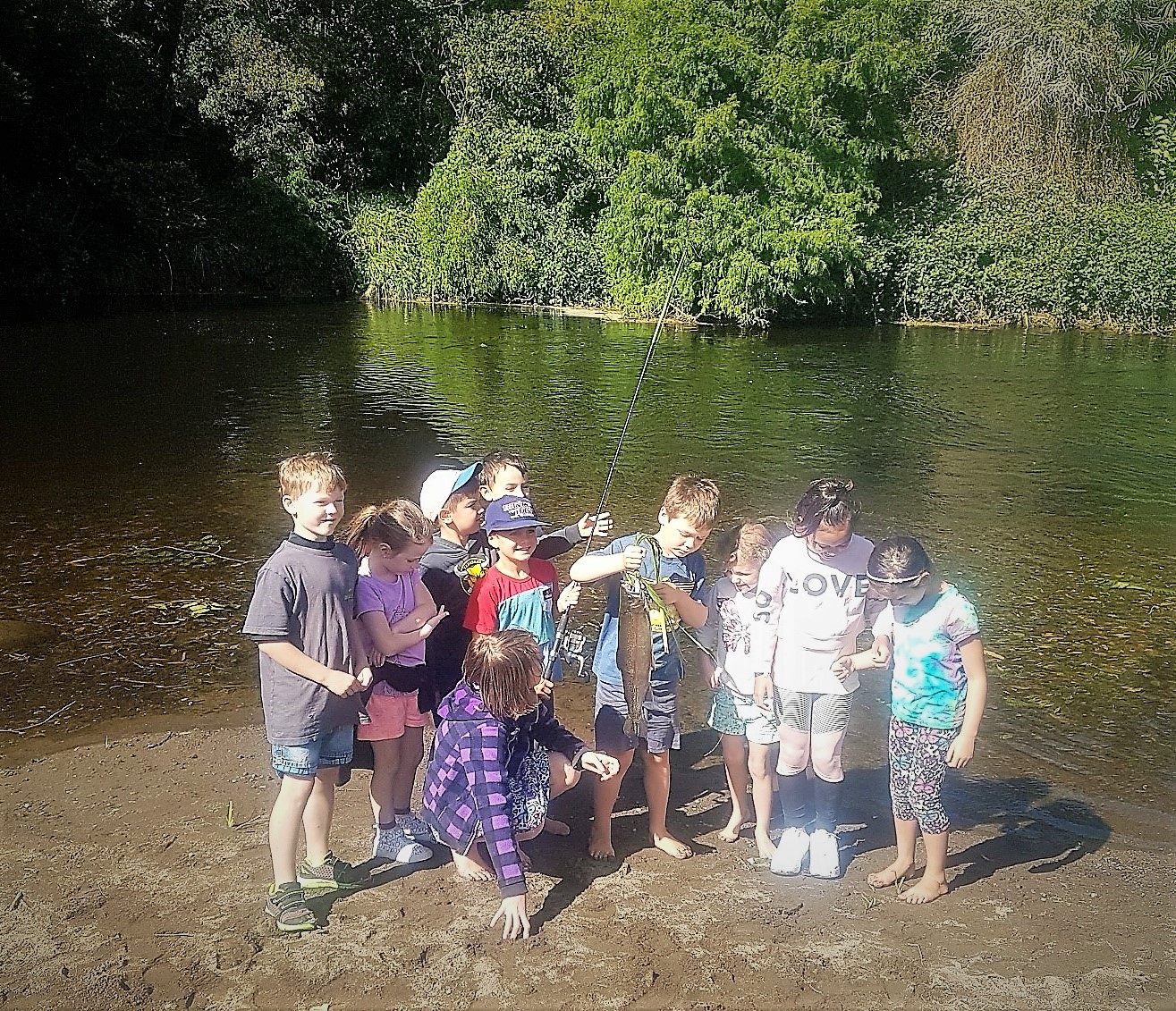 TRL2Mar19. A group of keen anglers from Stratford Primary School show of the rainbow trout they caught in the Patea River at Stratford.
