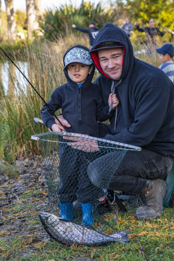 Seconds after the hooter went off, Connor Nicholson, 3, caught the first fish of the day with some help from dad Kain.