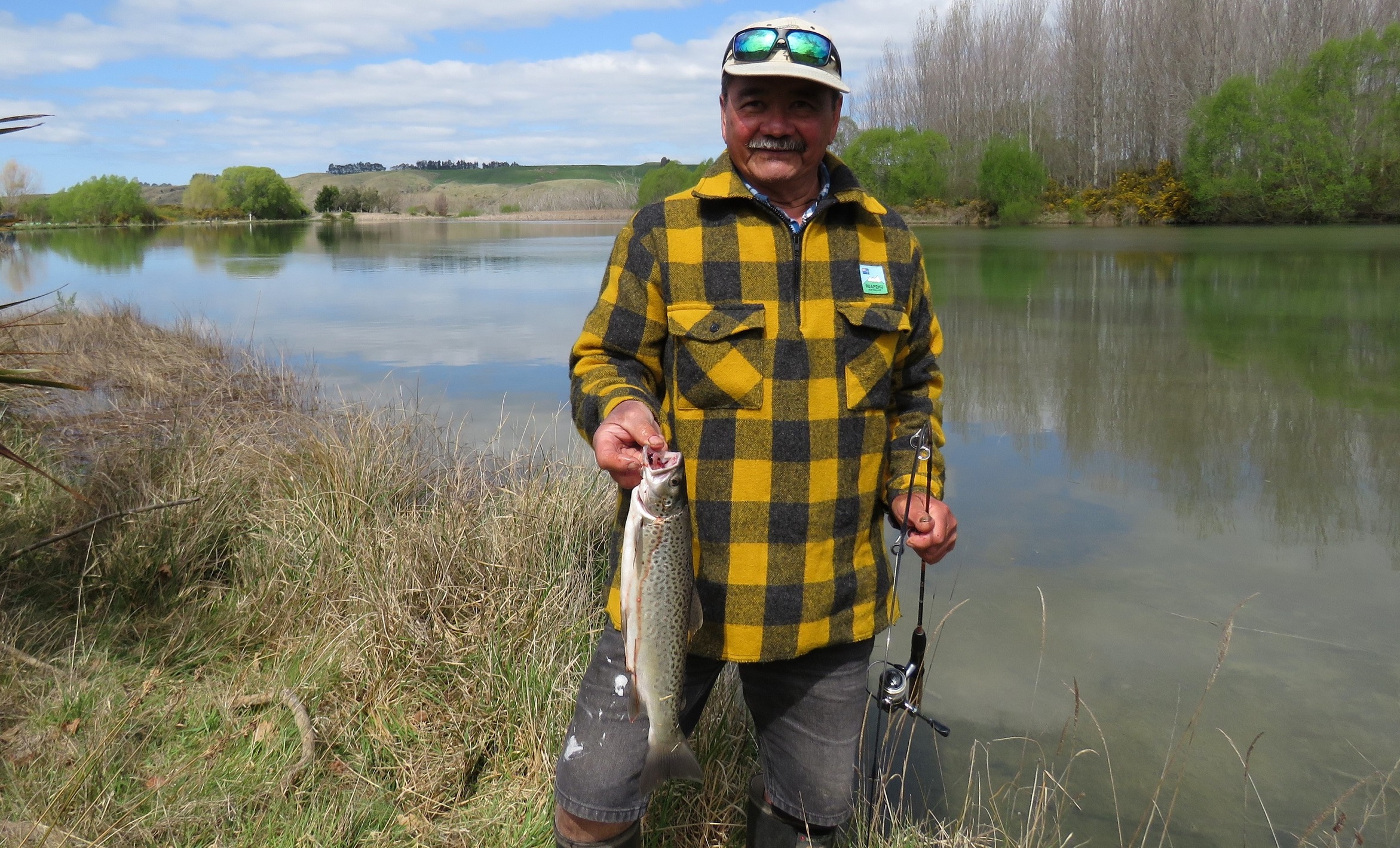 WFR2223.04 Frank Laban with his brown trout caught at Bortons Pond on a black n gold tassie lure Photo by Rhys Adams