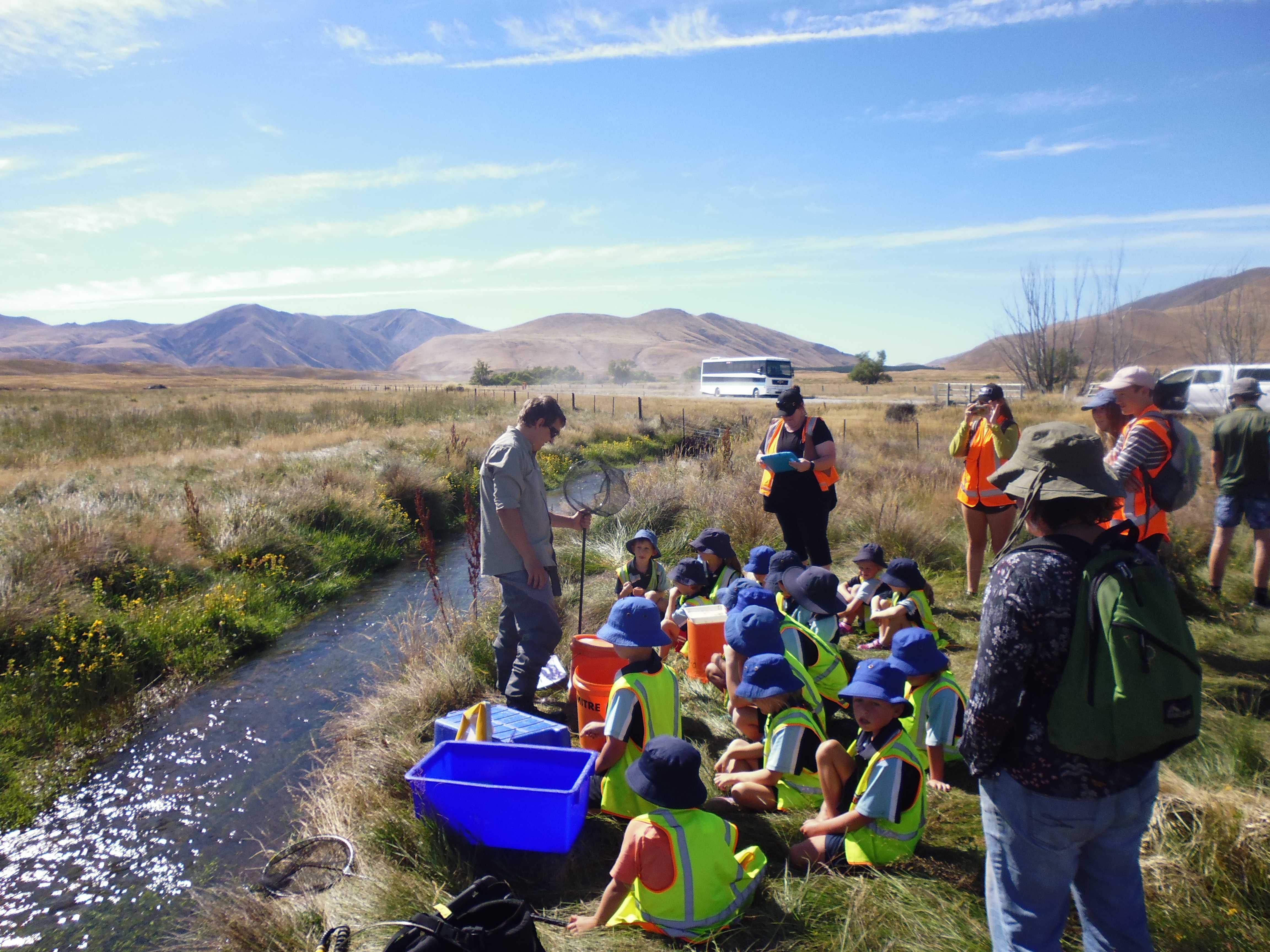 WFR1819.45 Fish Game Officer Jayde Couper teaches school kids about the aquatic ecosystem of Lambies Stream