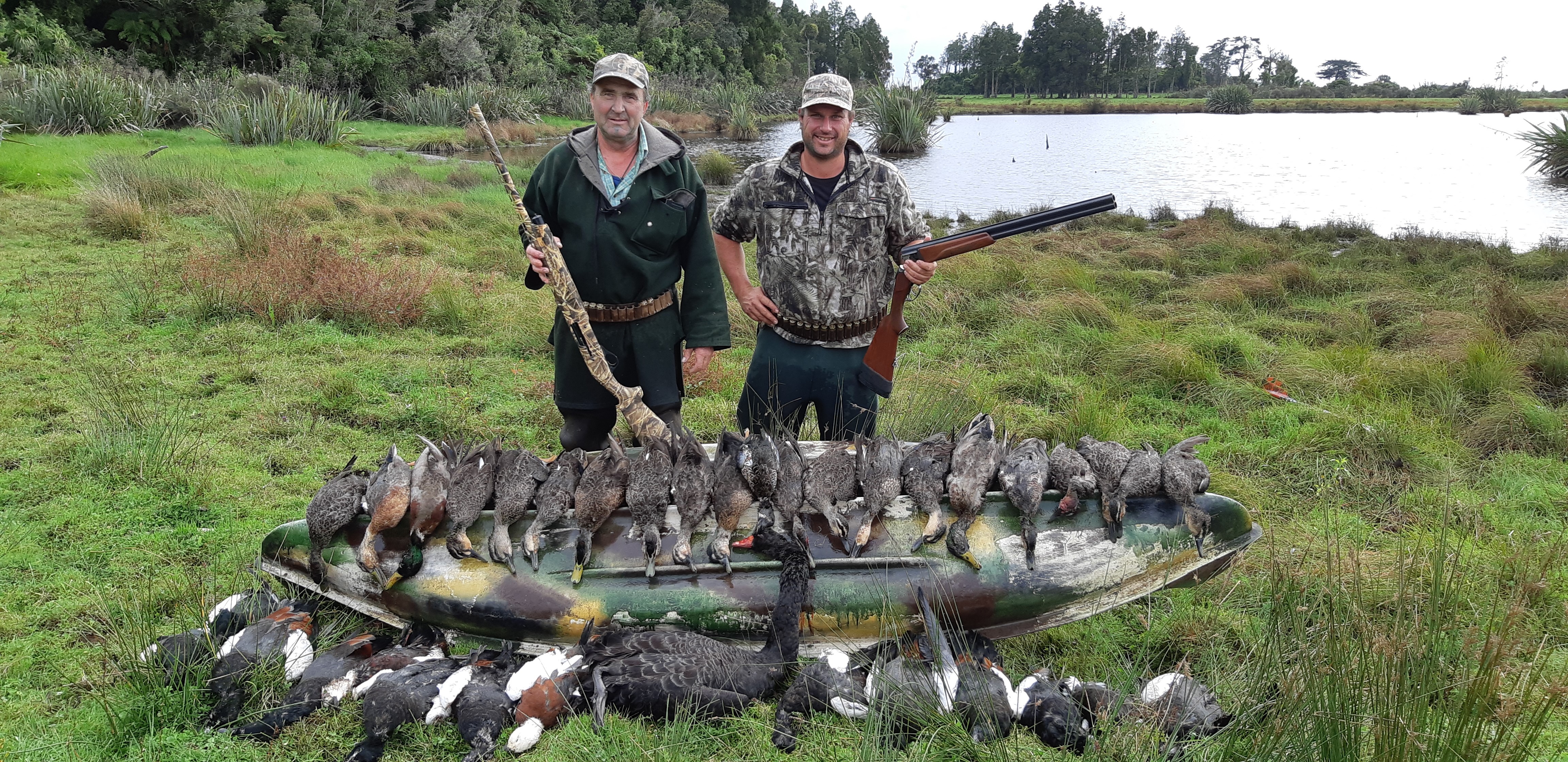 Happy hunters on the West Coast near Buller .